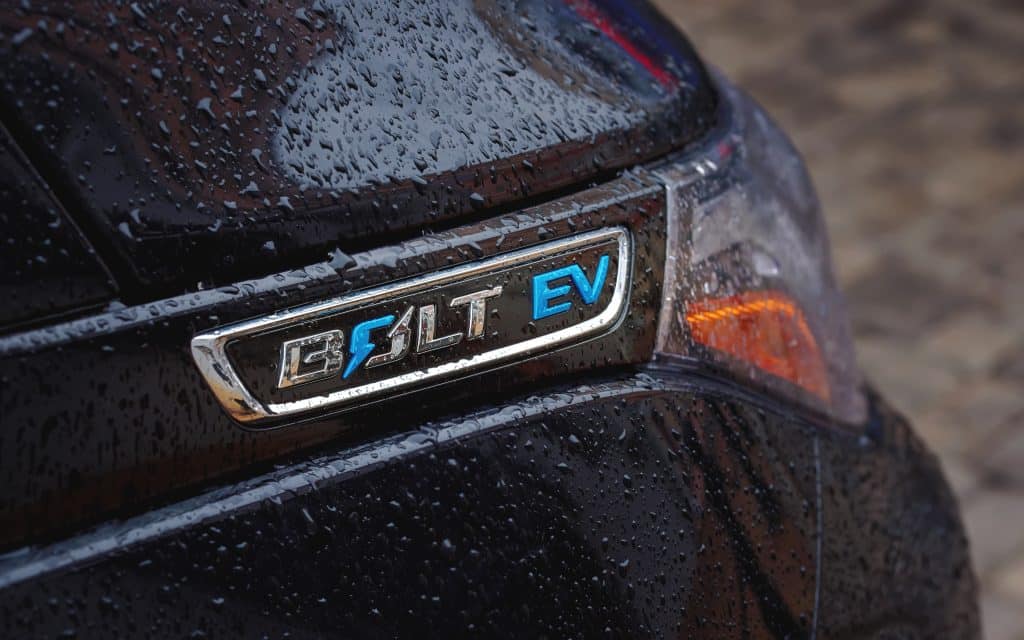 Chevrolet Bolt EV car logo with rain drops.