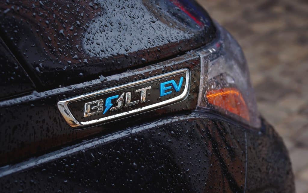 Chevrolet Bolt EV car logo with rain drops. 