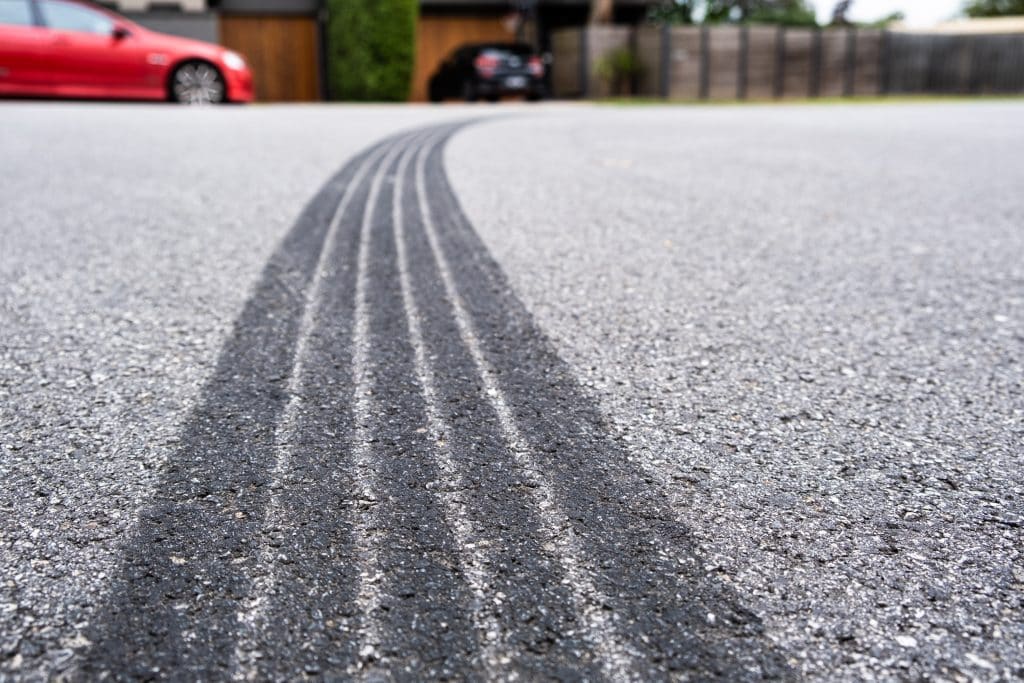Tire track mark on the asphalt from hard vehicle braking.